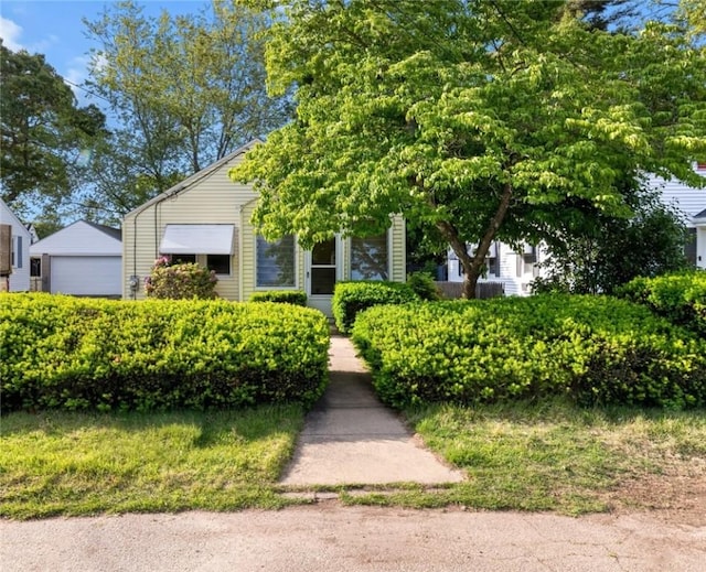 25 Community Rd, Warwick, RI 02889 - view of property hidden behind natural elements with a detached garage