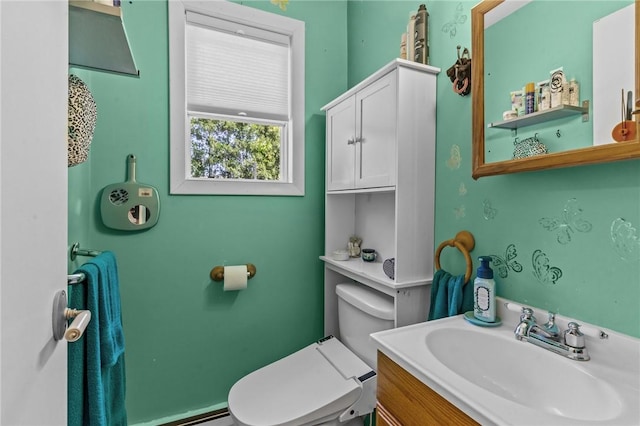 21 High Service Ave, North Providence, RI 02911 - half bathroom with toilet, vanity, and baseboard heating