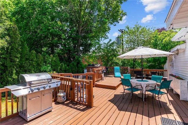 21 High Service Ave, North Providence, RI 02911 - wooden deck featuring outdoor dining space and area for grilling