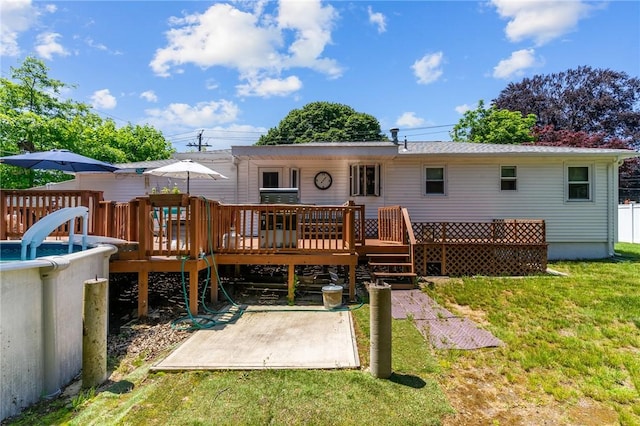 21 High Service Ave, North Providence, RI 02911 - rear view of property featuring a wooden deck, a yard, and a patio