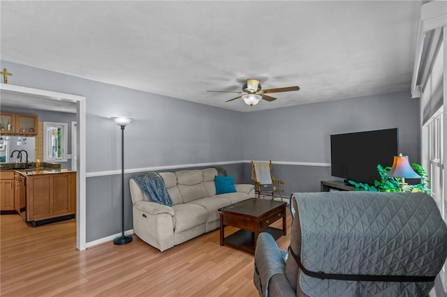 21 High Service Ave, North Providence, RI 02911 - living area featuring light wood finished floors, ceiling fan, and baseboards