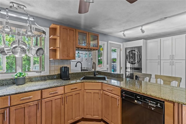 21 High Service Ave, North Providence, RI 02911 - kitchen with dishwasher, estacked washer and dryer, a sink, a peninsula, and a ceiling fan