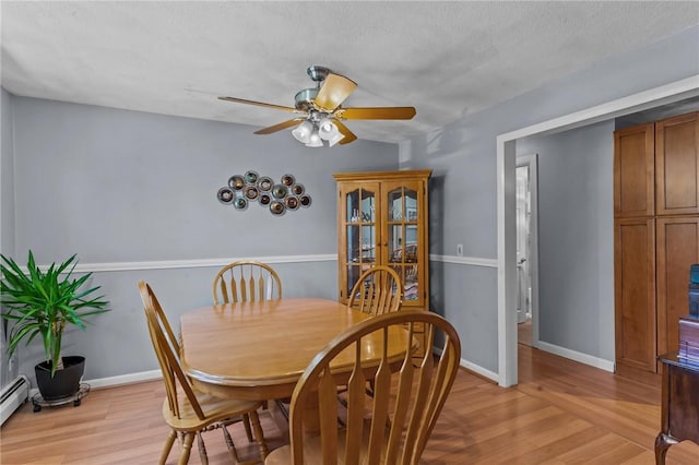 21 High Service Ave, North Providence, RI 02911 - dining area featuring light wood-style floors, ceiling fan, and baseboards