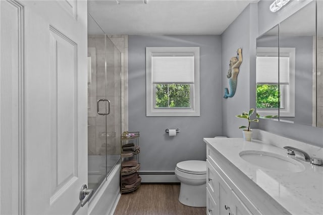 21 High Service Ave, North Providence, RI 02911 - bathroom featuring baseboard heating, vanity, wood finished floors, toilet, and enclosed tub / shower combo