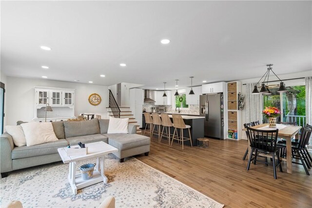 50 Maureen Dr, Smithfield, RI 02917 - living area featuring light wood-type flooring, recessed lighting, and stairway