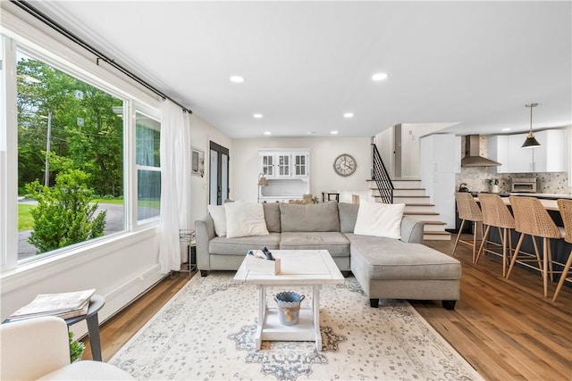 50 Maureen Dr, Smithfield, RI 02917 - living area with wood finished floors, recessed lighting, and stairway