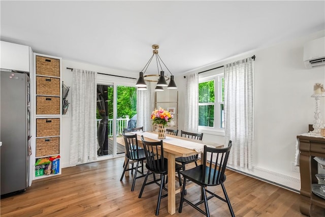 50 Maureen Dr, Smithfield, RI 02917 - dining space with wood finished floors and an AC wall unit