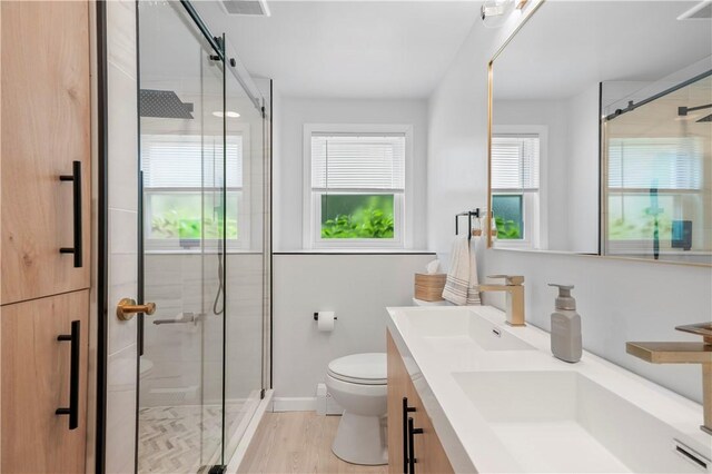 50 Maureen Dr, Smithfield, RI 02917 - bathroom featuring toilet, double vanity, a shower stall, and baseboards