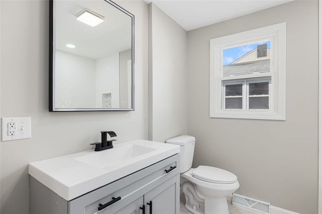 21 Victor Emanuel Ave, Providence, RI 02904 - bathroom with vanity, toilet, and baseboards