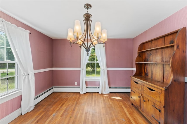 282 Seven Mile Rd, Scituate, RI 02831 - unfurnished dining area with light wood-style floors and a chandelier