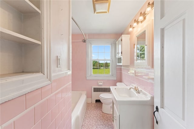282 Seven Mile Rd, Scituate, RI 02831 - bathroom with radiator heating unit, tile walls, vanity, toilet, and bathing tub / shower combination