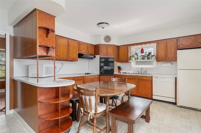 32 N Clarendon St, Cranston, RI 02910 - kitchen with open shelves, black appliances, a sink, and brown cabinets