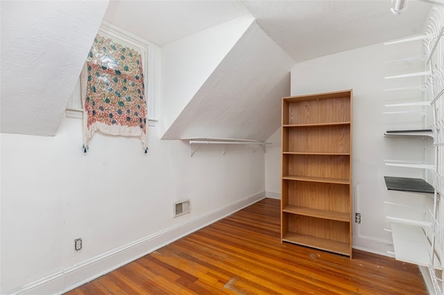 32 N Clarendon St, Cranston, RI 02910 - additional living space featuring wood finished floors, baseboards, and lofted ceiling