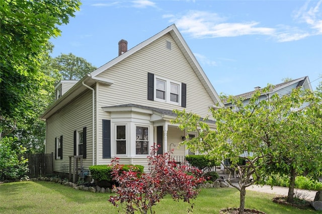 32 N Clarendon St, Cranston, RI 02910 - view of front of home featuring a chimney