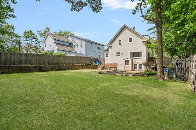 32 N Clarendon St, Cranston, RI 02910 - rear view of property with a chimney and central AC