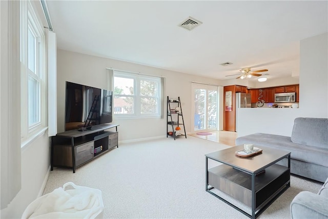 2970 Mendon Rd Unit 53, Cumberland, RI 02864 - living room with light colored carpet, baseboards, and a ceiling fan