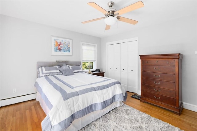 6 Humes Ave, Warwick, RI 02889 - bedroom with a baseboard radiator, light wood-type flooring, a closet, and a ceiling fan