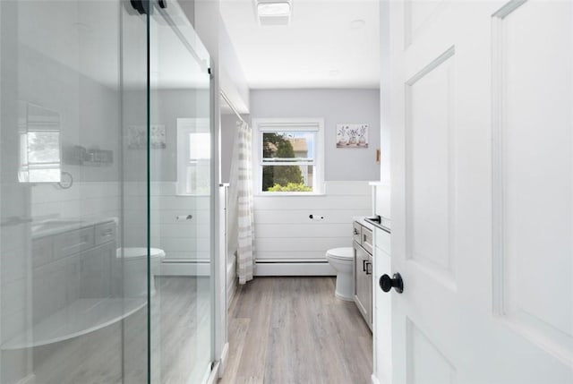 6 Humes Ave, Warwick, RI 02889 - full bathroom featuring a stall shower, wood finished floors, vanity, a wainscoted wall, and tile walls