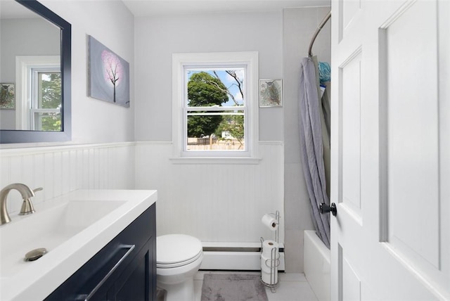 6 Humes Ave, Warwick, RI 02889 - full bath featuring vanity, a wainscoted wall, shower / bath combo, a baseboard heating unit, and tile patterned flooring