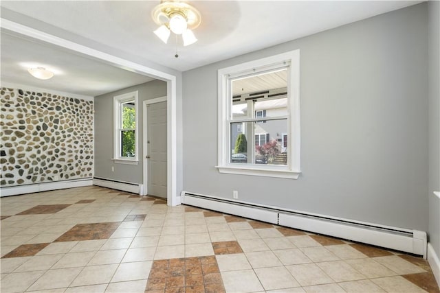 103 Henrietta St, Providence, RI 02904 - spare room with a baseboard heating unit, ceiling fan, light tile patterned flooring, and baseboards