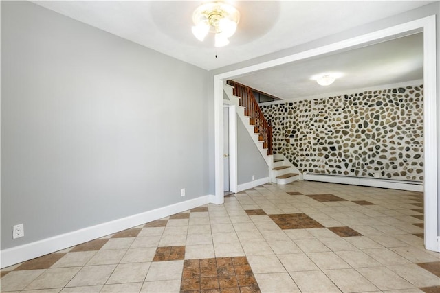103 Henrietta St, Providence, RI 02904 - unfurnished room featuring a baseboard radiator, ceiling fan, stairway, and baseboards