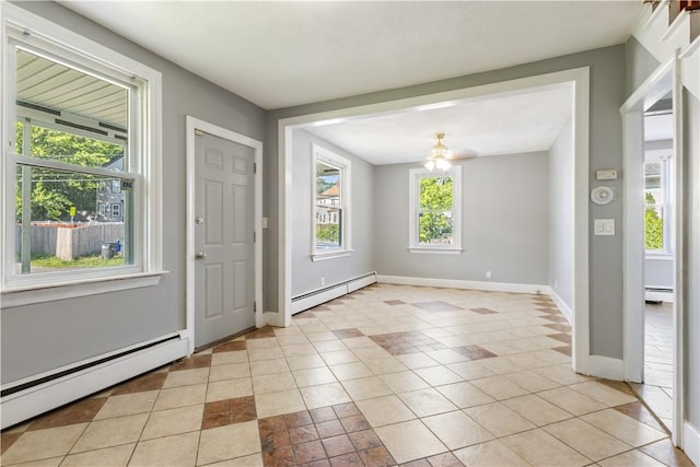 103 Henrietta St, Providence, RI 02904 - entryway with a baseboard radiator, baseboards, and a chandelier