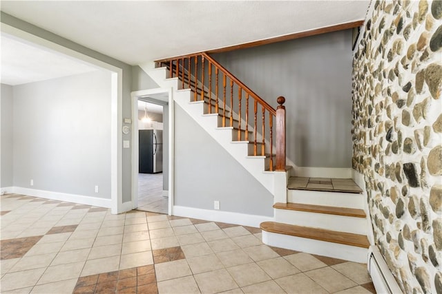 103 Henrietta St, Providence, RI 02904 - stairway with a baseboard radiator, tile patterned floors, and baseboards