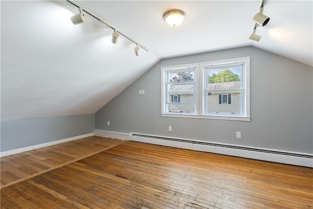 103 Henrietta St, Providence, RI 02904 - bonus room with a baseboard heating unit, vaulted ceiling, baseboards, and hardwood / wood-style floors