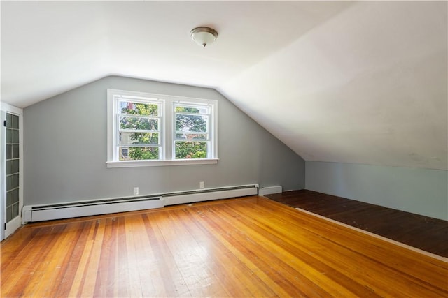 103 Henrietta St, Providence, RI 02904 - bonus room featuring hardwood / wood-style floors, vaulted ceiling, and a baseboard radiator