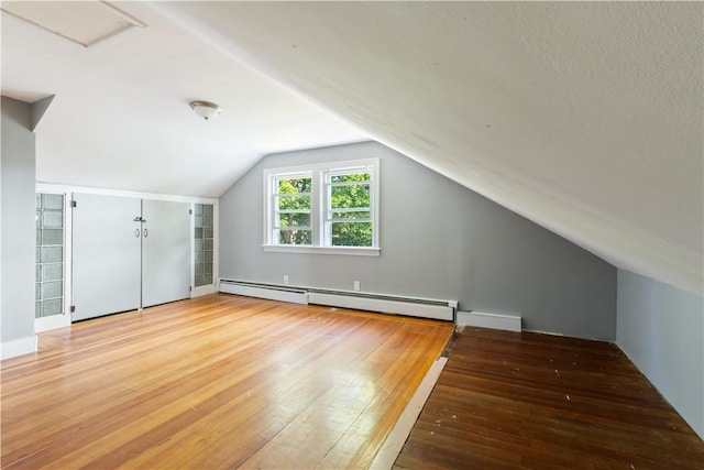 103 Henrietta St, Providence, RI 02904 - bonus room with a baseboard heating unit, hardwood / wood-style floors, and vaulted ceiling