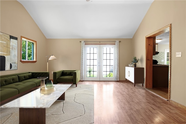 295 Chestnut St, Warwick, RI 02888 - living area with vaulted ceiling, wood finished floors, french doors, and baseboards