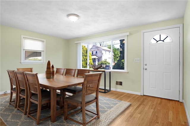295 Chestnut St, Warwick, RI 02888 - dining area featuring light wood-type flooring and baseboards