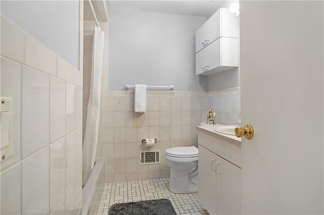 295 Chestnut St, Warwick, RI 02888 - bathroom with tile walls, vanity, toilet, tile patterned floors, and shower / bath combination with curtain