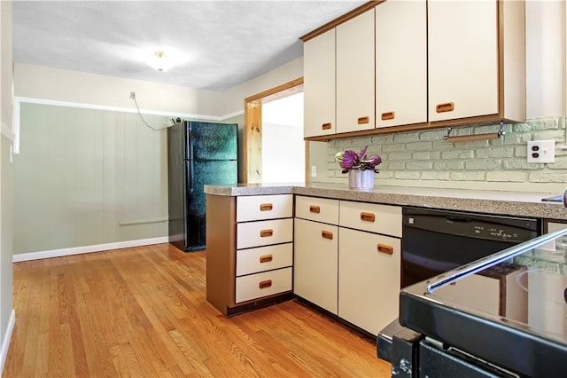 295 Chestnut St, Warwick, RI 02888 - kitchen featuring black appliances, decorative backsplash, light wood finished floors, white cabinets, and light countertops