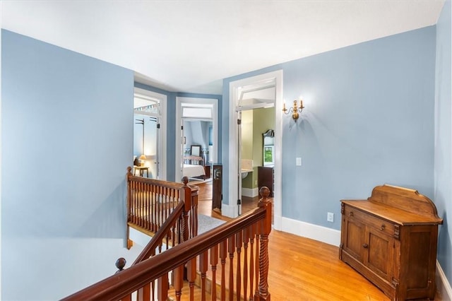 59 Woodland Rd, Woonsocket, RI 02895 - hall featuring an upstairs landing, light wood-style flooring, and baseboards