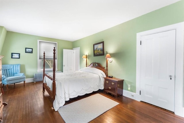 59 Woodland Rd, Woonsocket, RI 02895 - bedroom featuring radiator and dark wood-type flooring