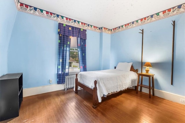 59 Woodland Rd, Woonsocket, RI 02895 - bedroom featuring radiator heating unit, hardwood / wood-style flooring, and baseboards