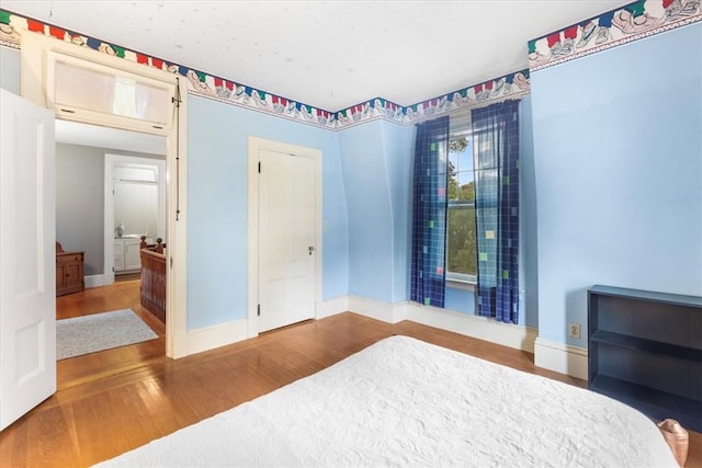 59 Woodland Rd, Woonsocket, RI 02895 - bedroom with wood finished floors and baseboards