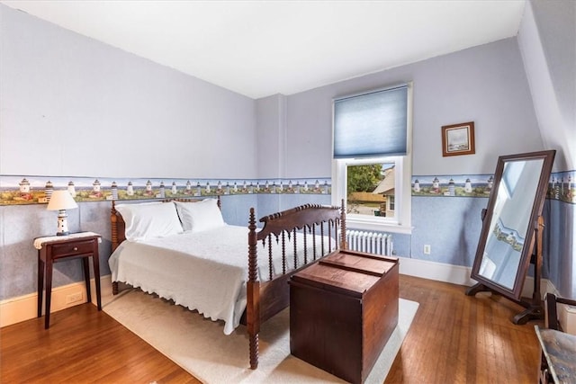 59 Woodland Rd, Woonsocket, RI 02895 - bedroom featuring radiator, wood finished floors, and baseboards