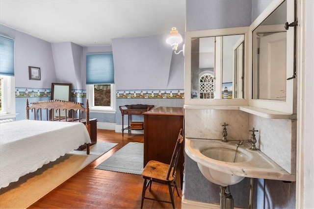 59 Woodland Rd, Woonsocket, RI 02895 - bedroom with multiple windows, wood finished floors, and a sink