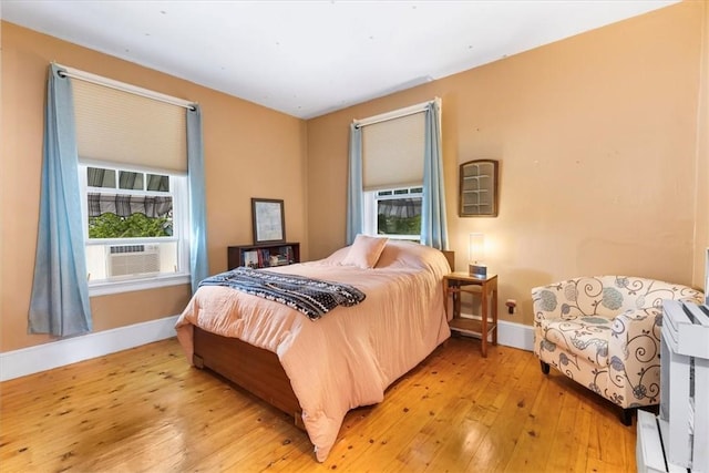 59 Woodland Rd, Woonsocket, RI 02895 - bedroom with baseboards, light wood finished floors, and multiple windows