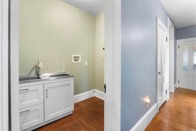 59 Woodland Rd, Woonsocket, RI 02895 - hall with dark wood-style floors, baseboards, and a sink