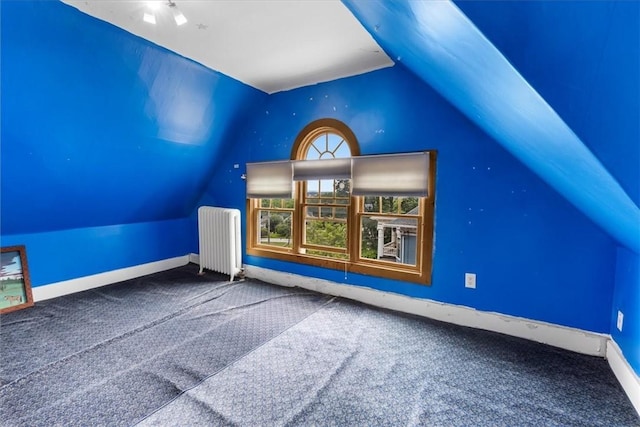 59 Woodland Rd, Woonsocket, RI 02895 - additional living space featuring radiator heating unit, lofted ceiling, carpet, and baseboards