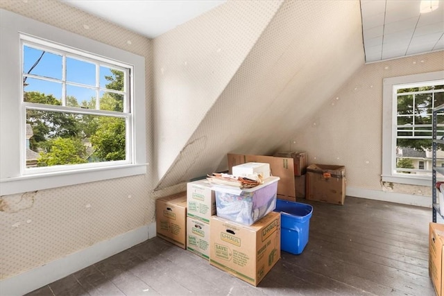 59 Woodland Rd, Woonsocket, RI 02895 - additional living space with plenty of natural light, vaulted ceiling, hardwood / wood-style flooring, and baseboards
