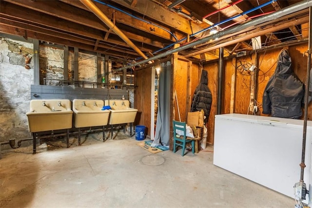 59 Woodland Rd, Woonsocket, RI 02895 - unfinished below grade area with a sink and fridge