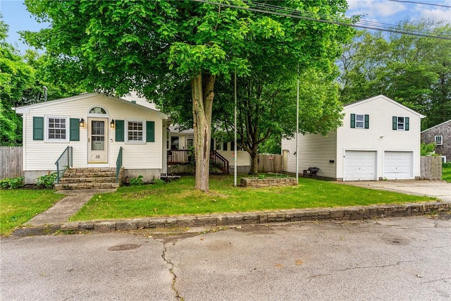 16 Spectacle Ave, Warwick, RI 02888 - view of front of house featuring a garage, concrete driveway, and entry steps