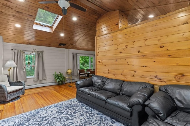 16 Spectacle Ave, Warwick, RI 02888 - living room with ceiling fan, a skylight, vaulted ceiling, wood-type flooring, and wood ceiling