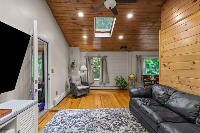 16 Spectacle Ave, Warwick, RI 02888 - living area with baseboard heating, ceiling fan, lofted ceiling, a skylight, and recessed lighting