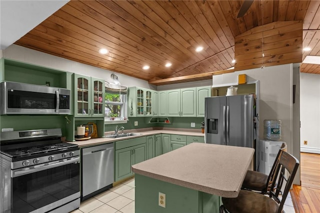 16 Spectacle Ave, Warwick, RI 02888 - kitchen featuring appliances with stainless steel finishes, green cabinetry, wood ceiling, a sink, and a kitchen bar
