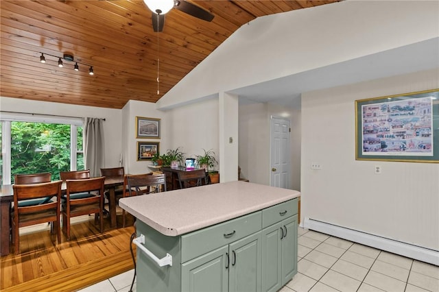 16 Spectacle Ave, Warwick, RI 02888 - kitchen with green cabinets, light tile patterned floors, wooden ceiling, a baseboard radiator, and light countertops